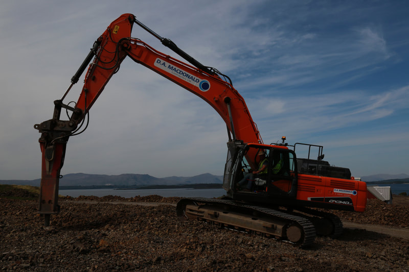 A 35t Doosan excavator with the sea in the background